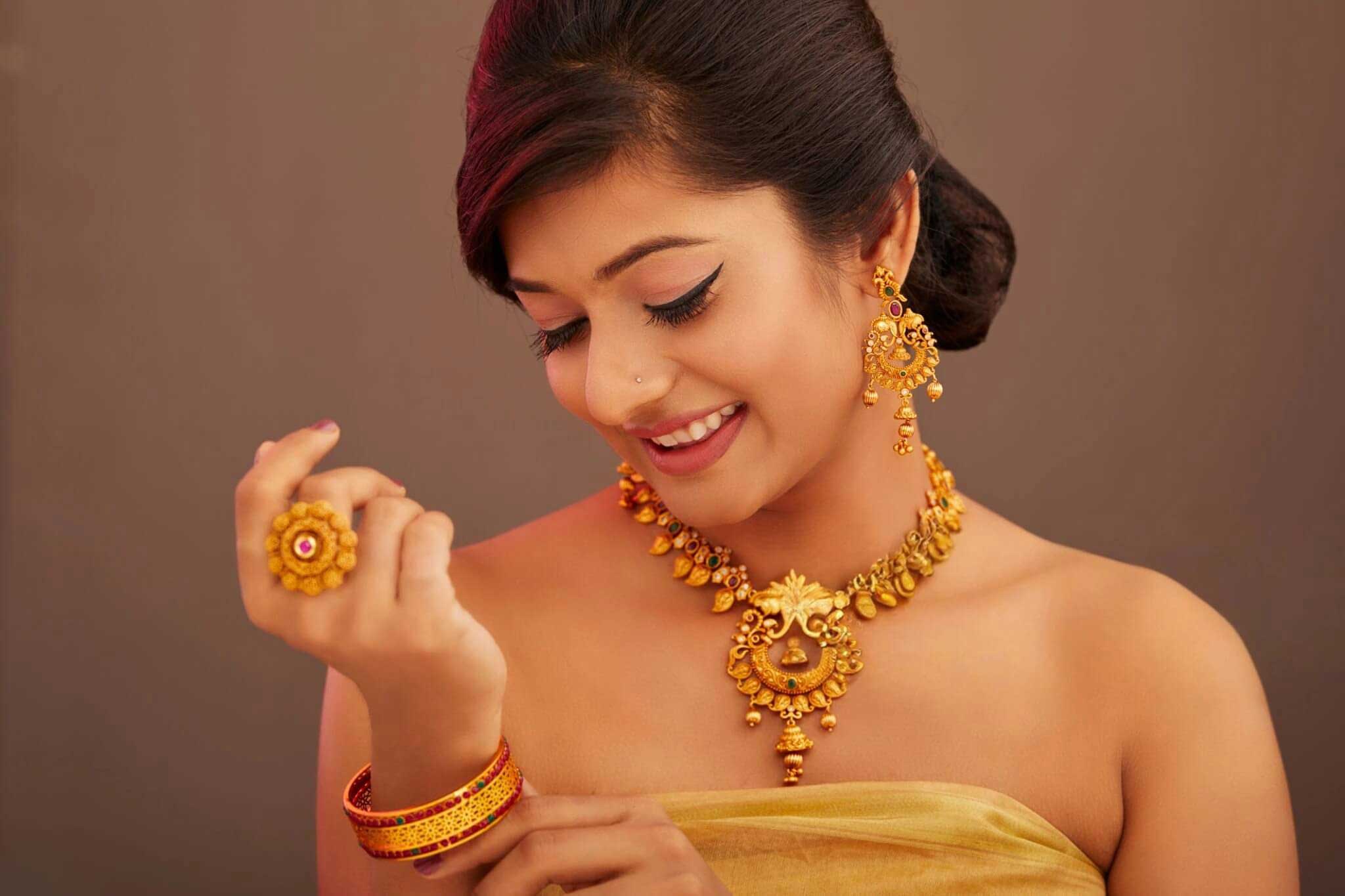 A woman from India wearing 24k gold jewelry
