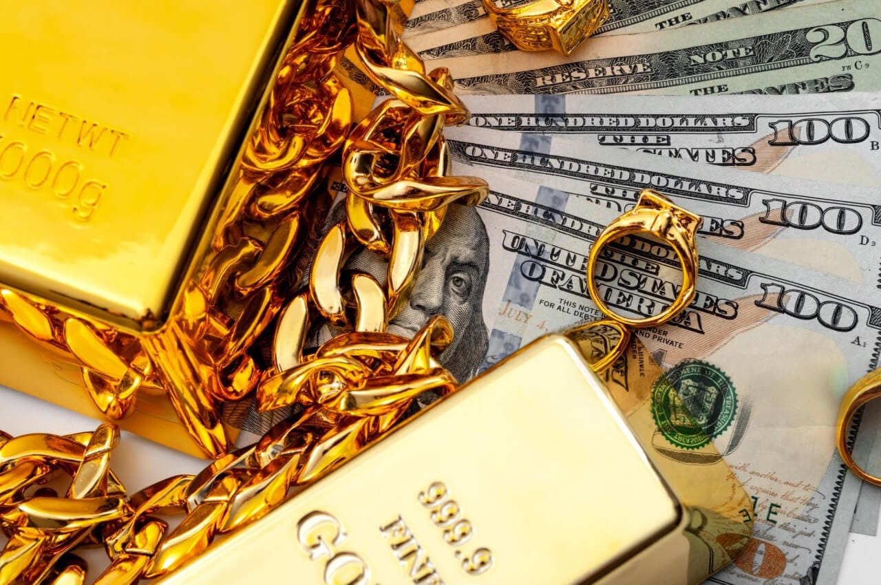24k gold jewelry, gold bar and money